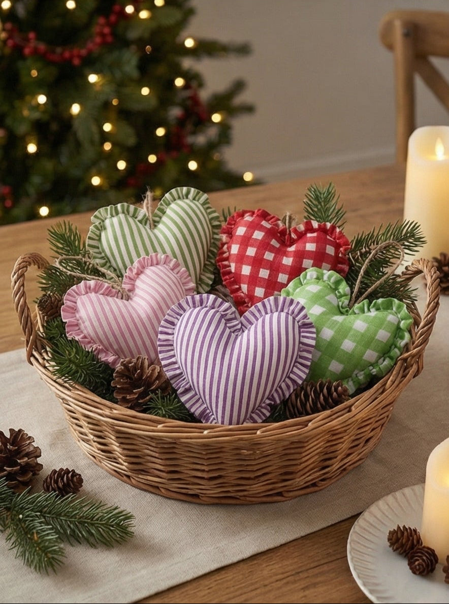 Heart-shaped Christmas decorations on a tree, mantel, and staircase.