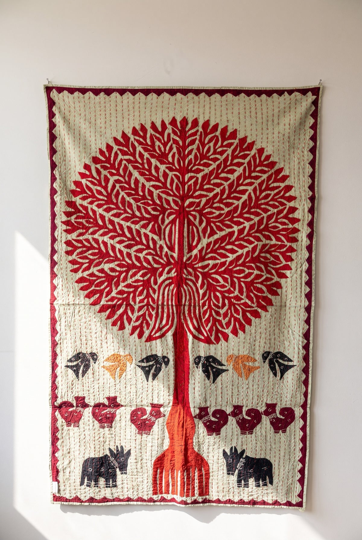 Whisper Mist Kantha Appliqué Pure Cotton Wall Hanging — full hanging in studio view