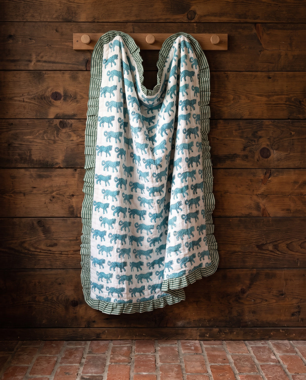 Elephant Meadow reversible cotton baby blanket, side one, rustic pegs