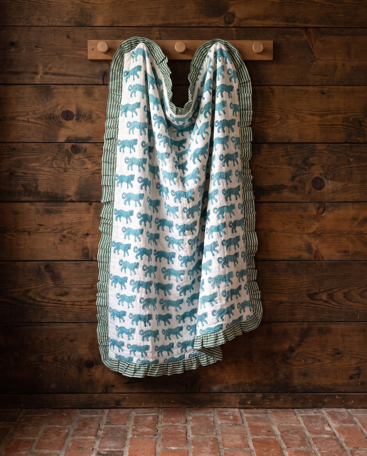 Elephant Meadow reversible cotton baby blanket, side one, rustic pegs