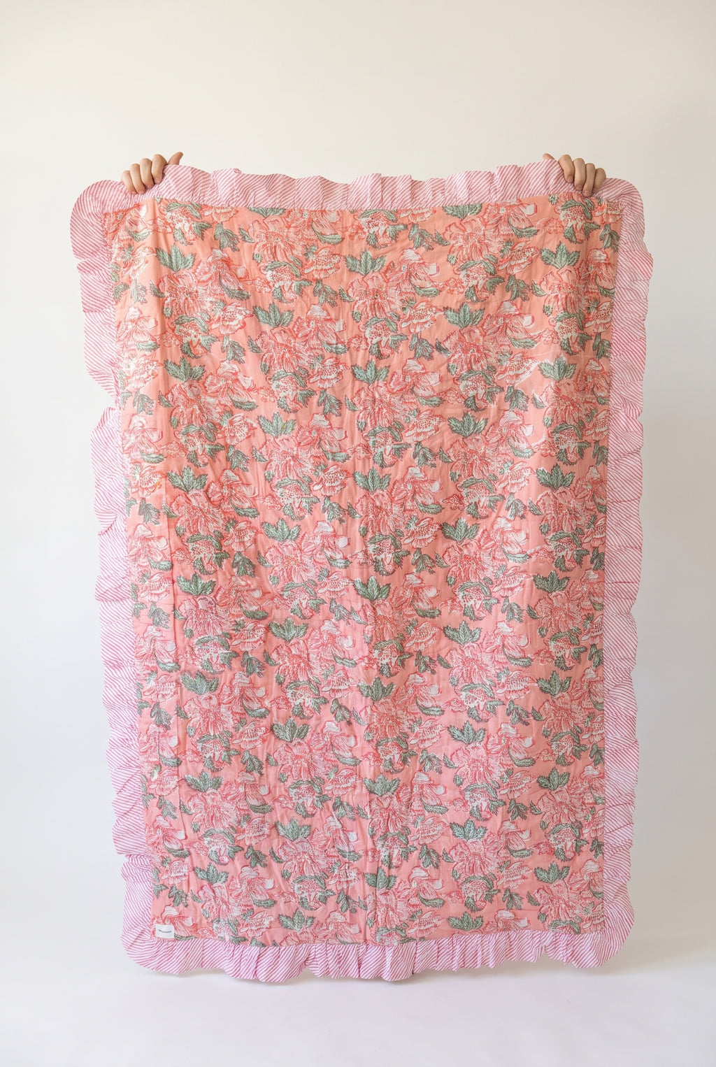 Petal Play reversible cotton baby blanket, side one, catalog hold
