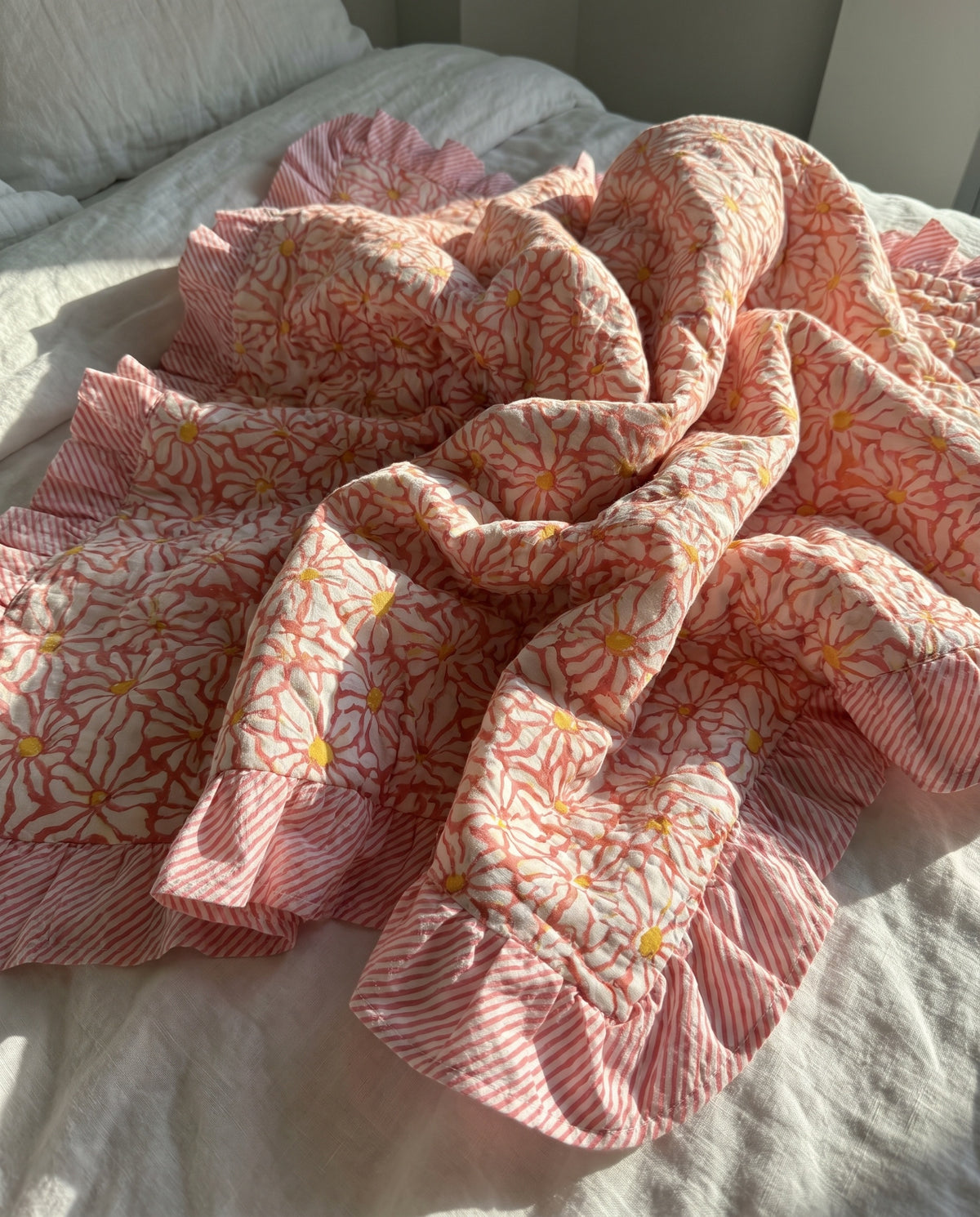 Petal Play reversible cotton baby blanket, side two, bed editorial