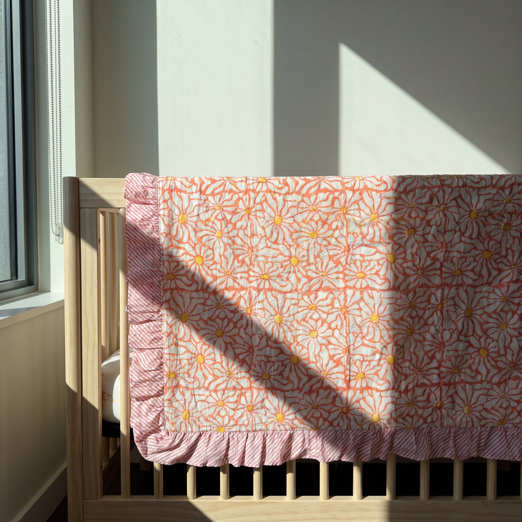 Petal Play reversible cotton baby blanket, side two, crib rail