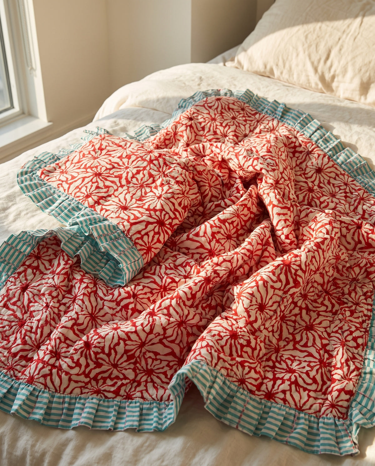 Garden Stories reversible cotton baby blanket, side one, bed editorial