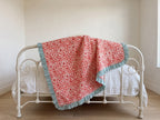 Garden Stories reversible cotton baby blanket, side one, iron bed