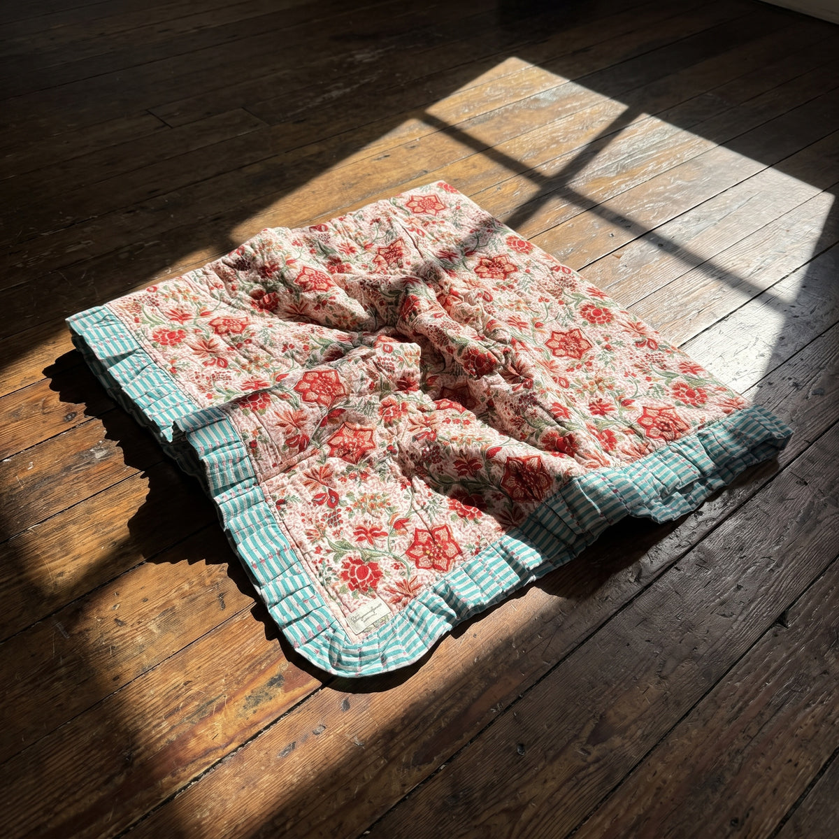 Garden Stories reversible cotton baby blanket, side two, floor