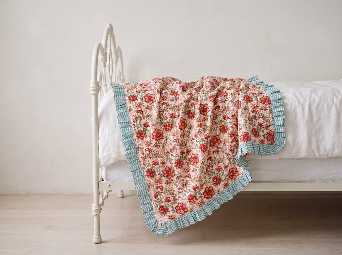 Garden Stories reversible cotton baby blanket, side two, iron bed