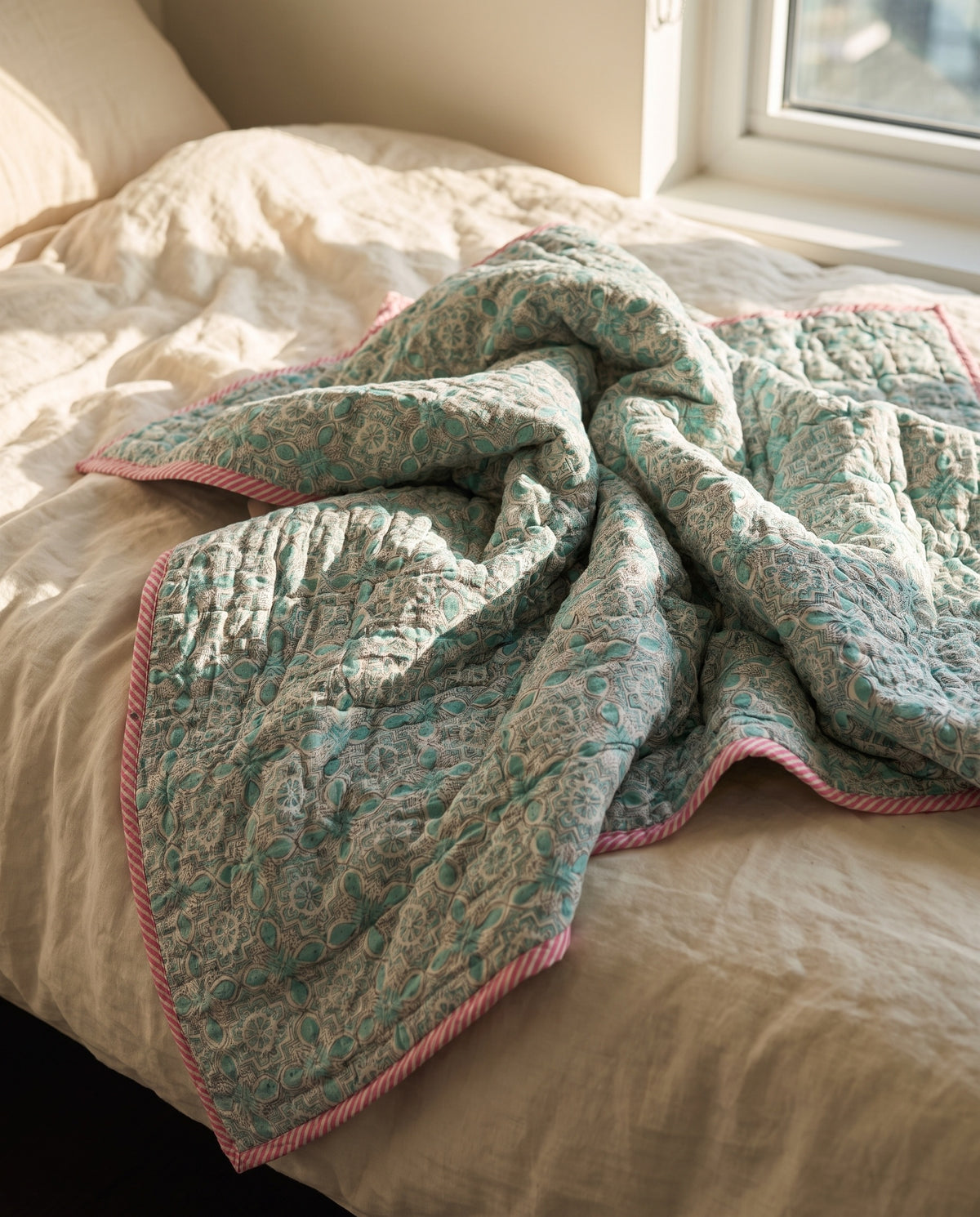Flamingo Daydreams reversible cotton baby blanket, side two, bed editorial