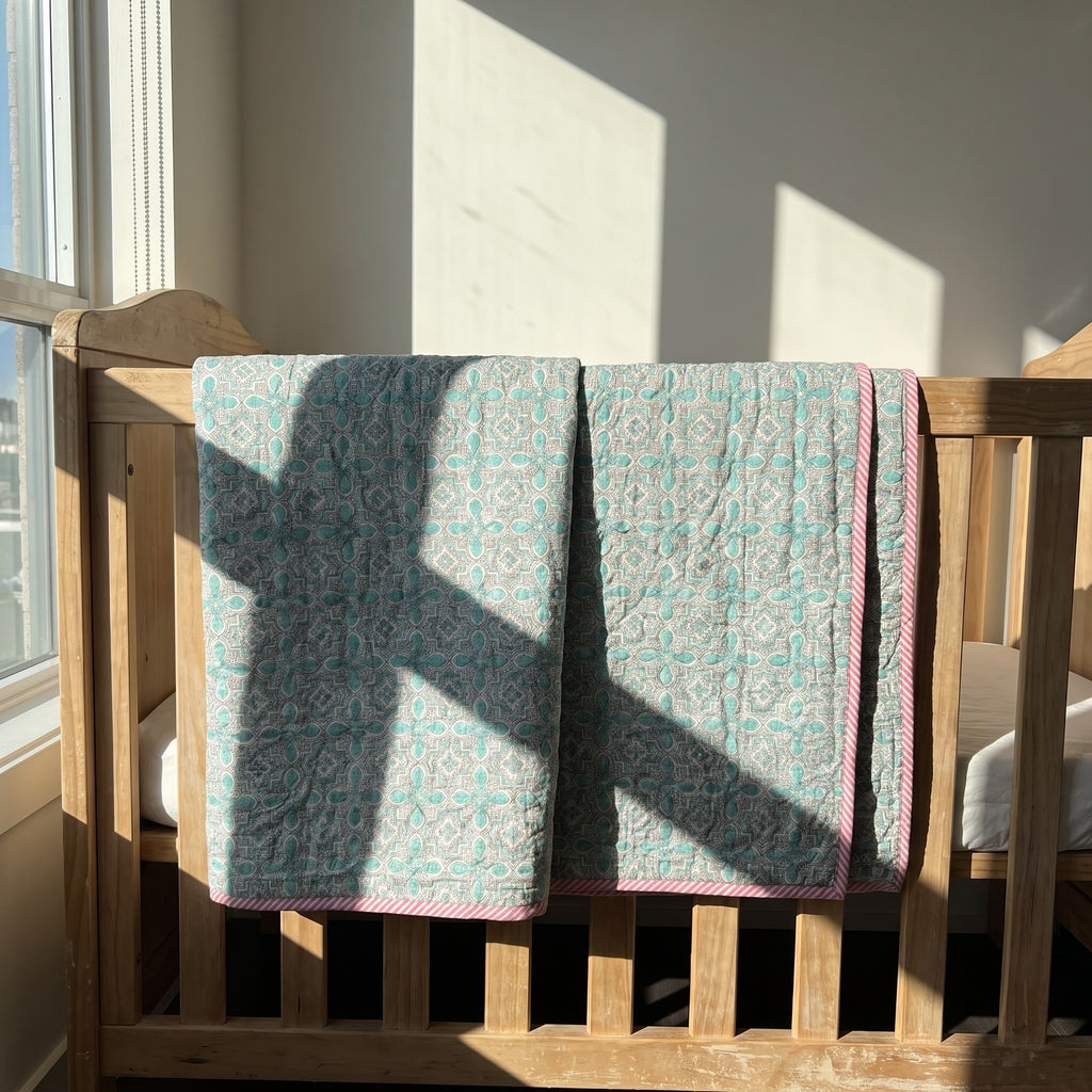 Flamingo Daydreams reversible cotton baby blanket, side two, crib rail