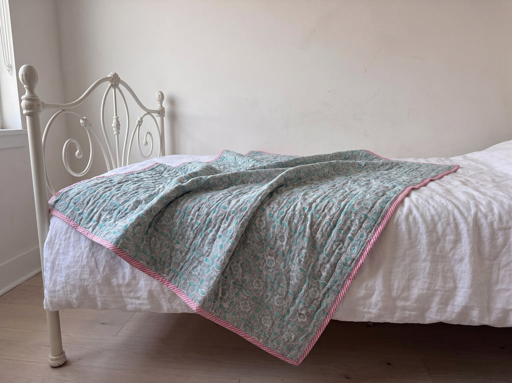 Flamingo Daydreams reversible cotton baby blanket, side two, iron bed