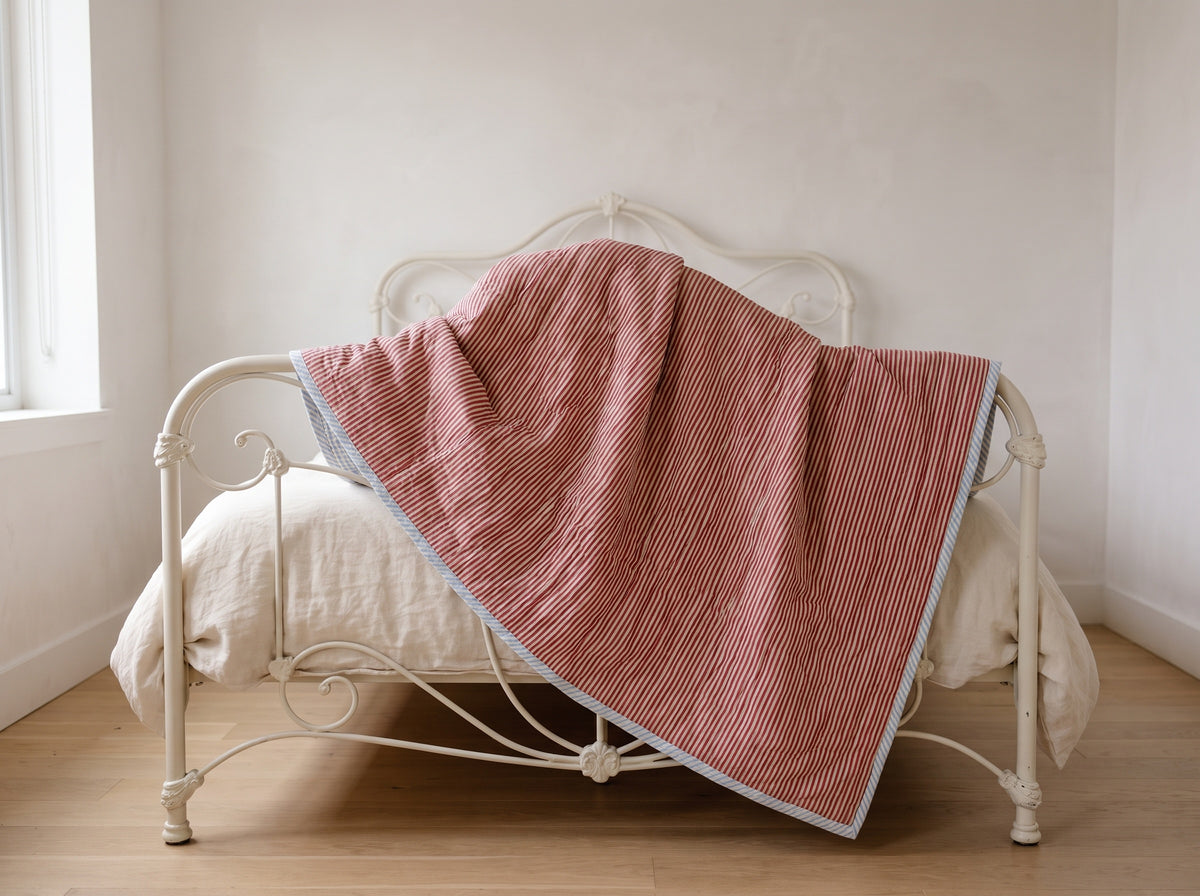 Puppy Promenade reversible cotton baby blanket, side one, iron bed