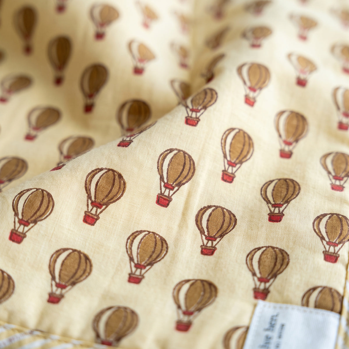 Balloon Adventures reversible cotton baby blanket, side one, macro