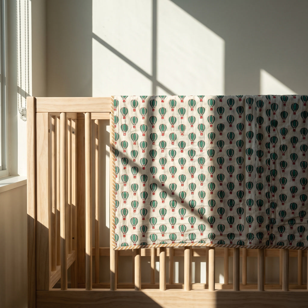 Balloon Adventures reversible cotton baby blanket, side two, crib rail