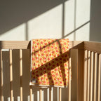 Storybook Friends reversible cotton baby blanket, side one, crib rail