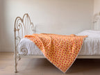 Storybook Friends reversible cotton baby blanket, side one, iron bed