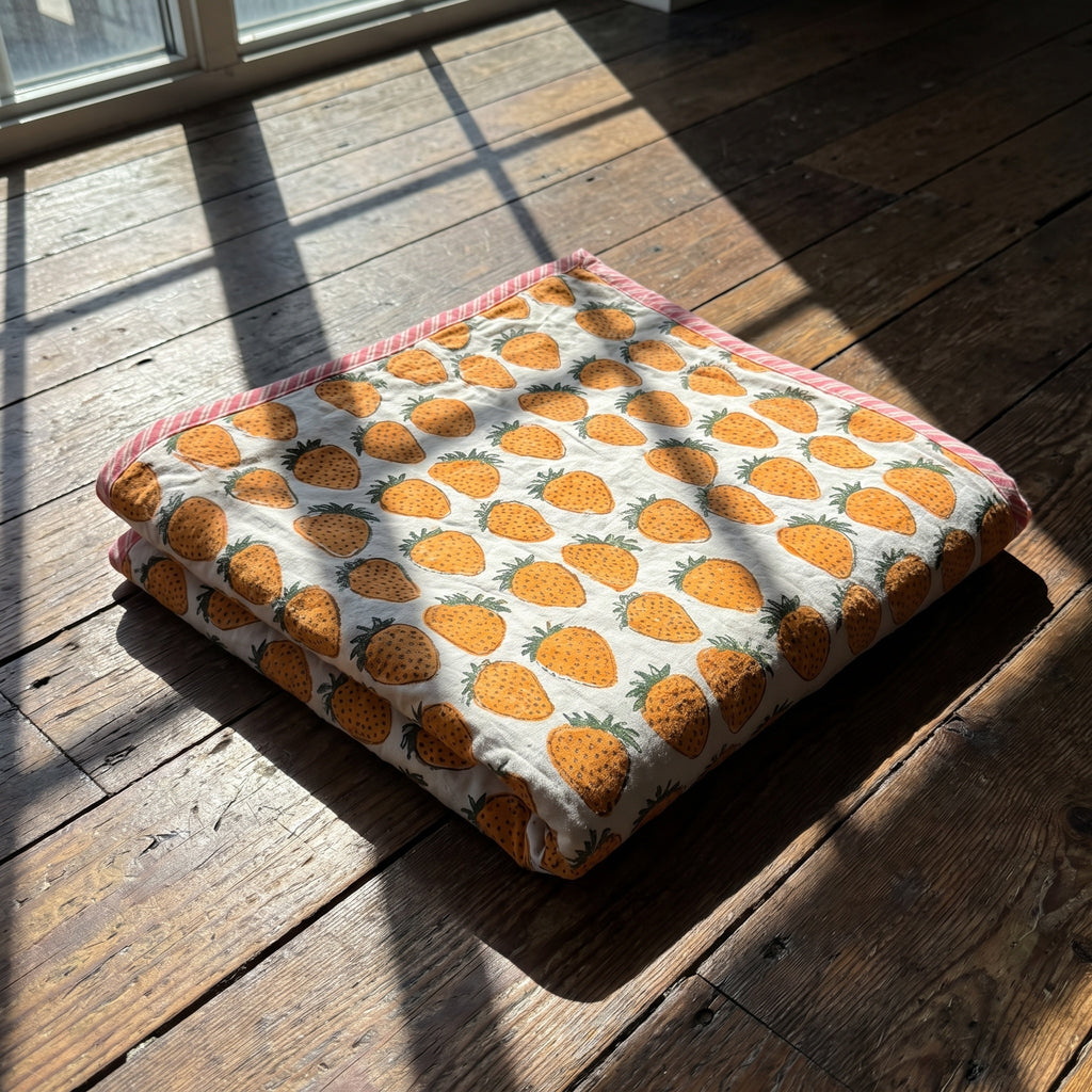 Berry Picnic reversible cotton baby blanket, side two, floor