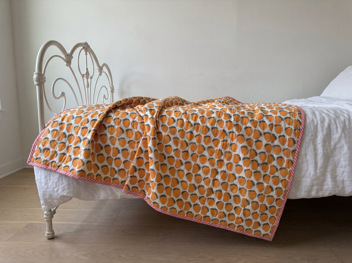 Berry Picnic reversible cotton baby blanket, side two, iron bed