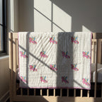 Unicorn Wishes reversible cotton baby blanket, side one, crib rail
