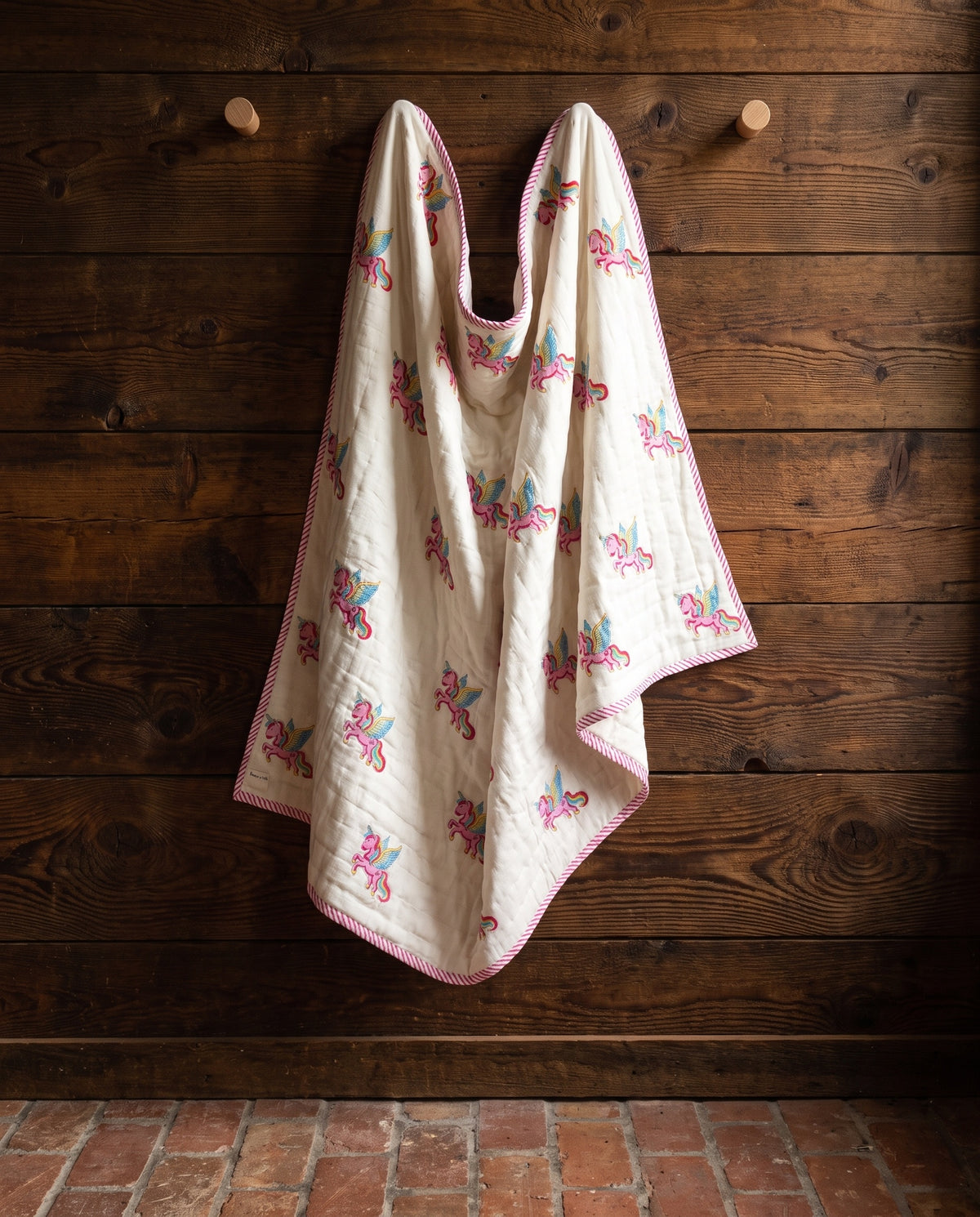 Unicorn Wishes reversible cotton baby blanket, side one, rustic pegs