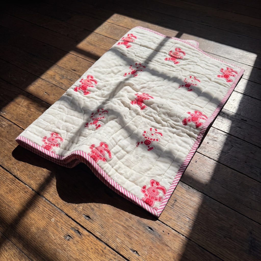 Unicorn Wishes reversible cotton baby blanket, side two, floor