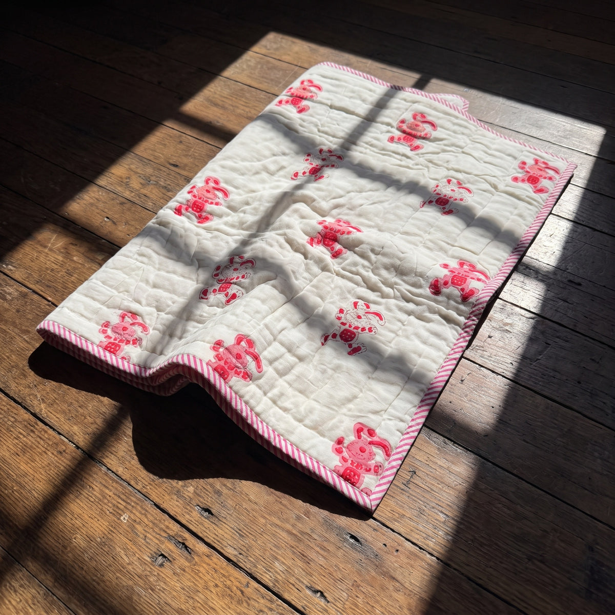 Unicorn Wishes reversible cotton baby blanket, side two, floor