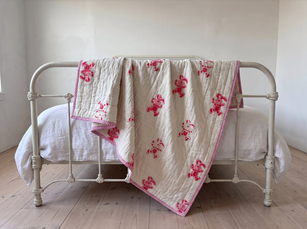 Unicorn Wishes reversible cotton baby blanket, side two, iron bed