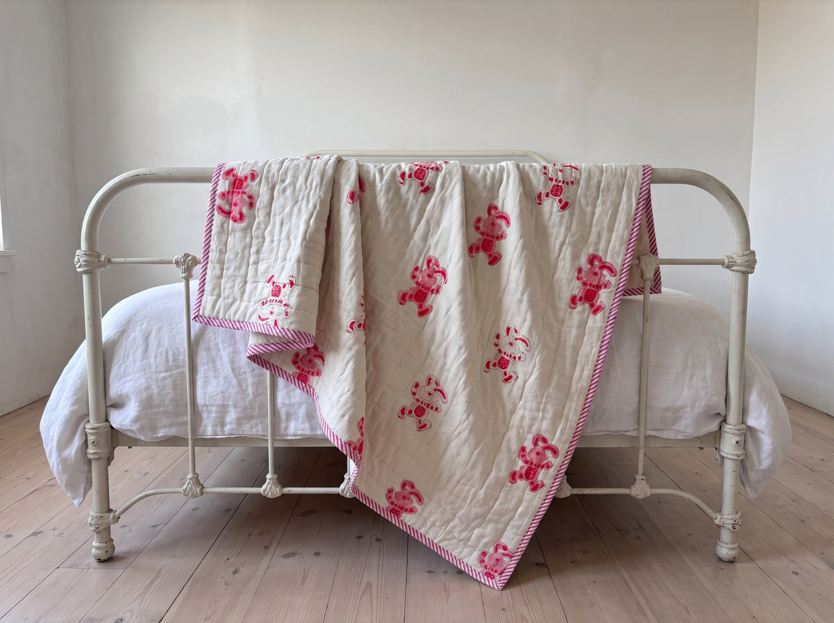 Unicorn Wishes reversible cotton baby blanket, side two, iron bed