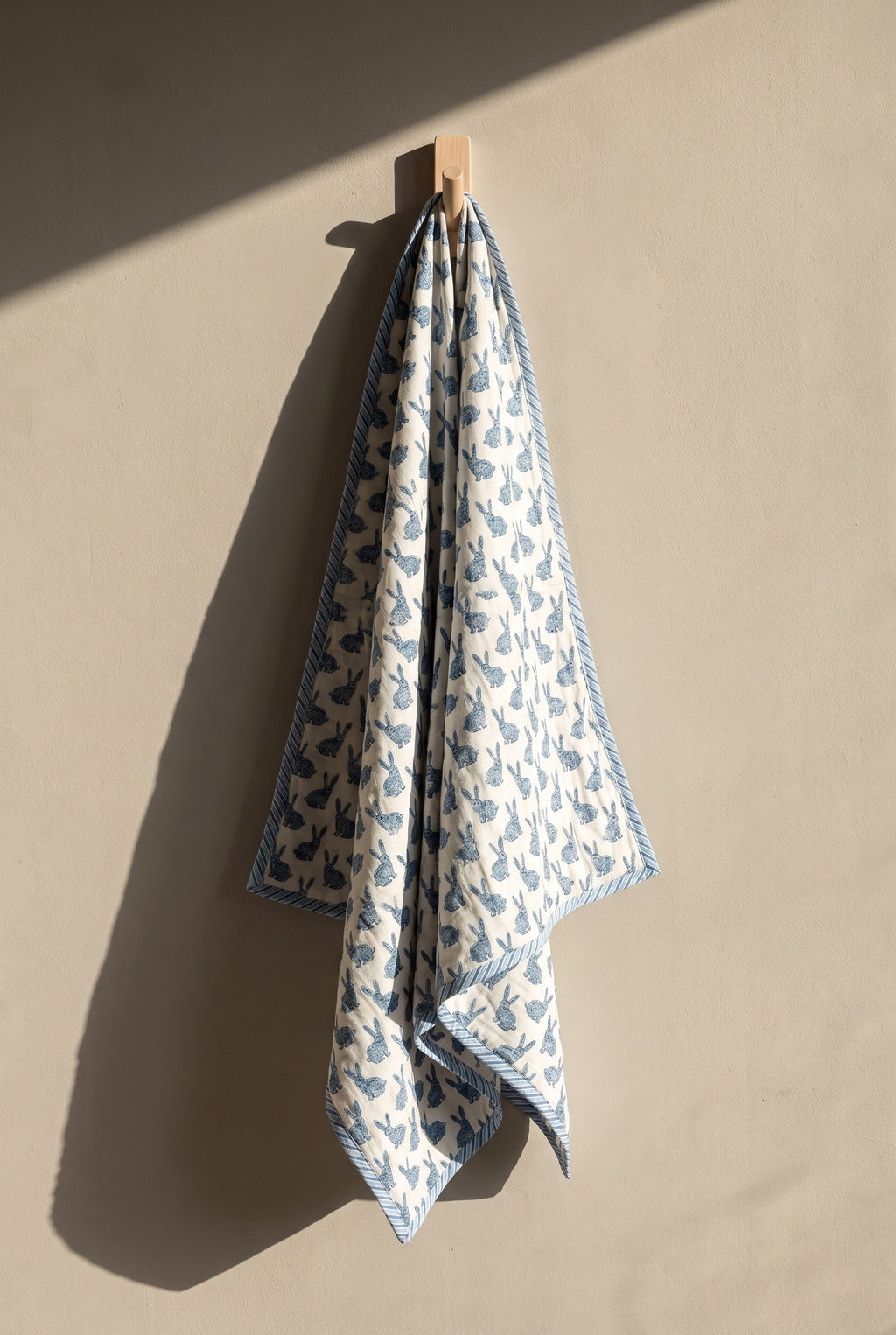 Bunny Trails reversible cotton baby blanket, side one, peg