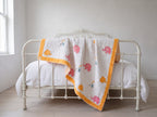 Elephant Wishes reversible cotton baby blanket, side one, iron bed