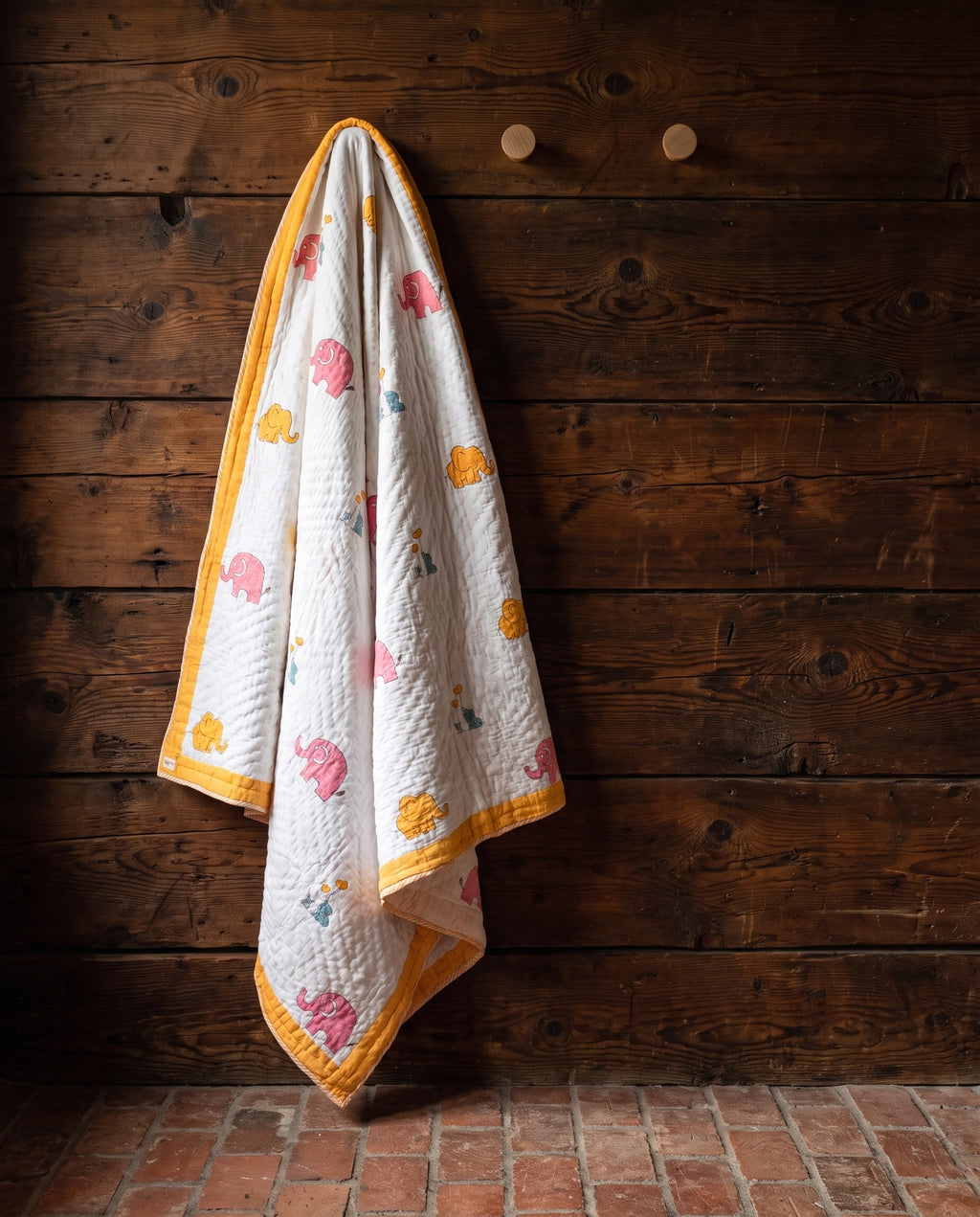 Elephant Wishes reversible cotton baby blanket, side one, rustic pegs