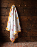 Elephant Wishes reversible cotton baby blanket, side one, rustic pegs