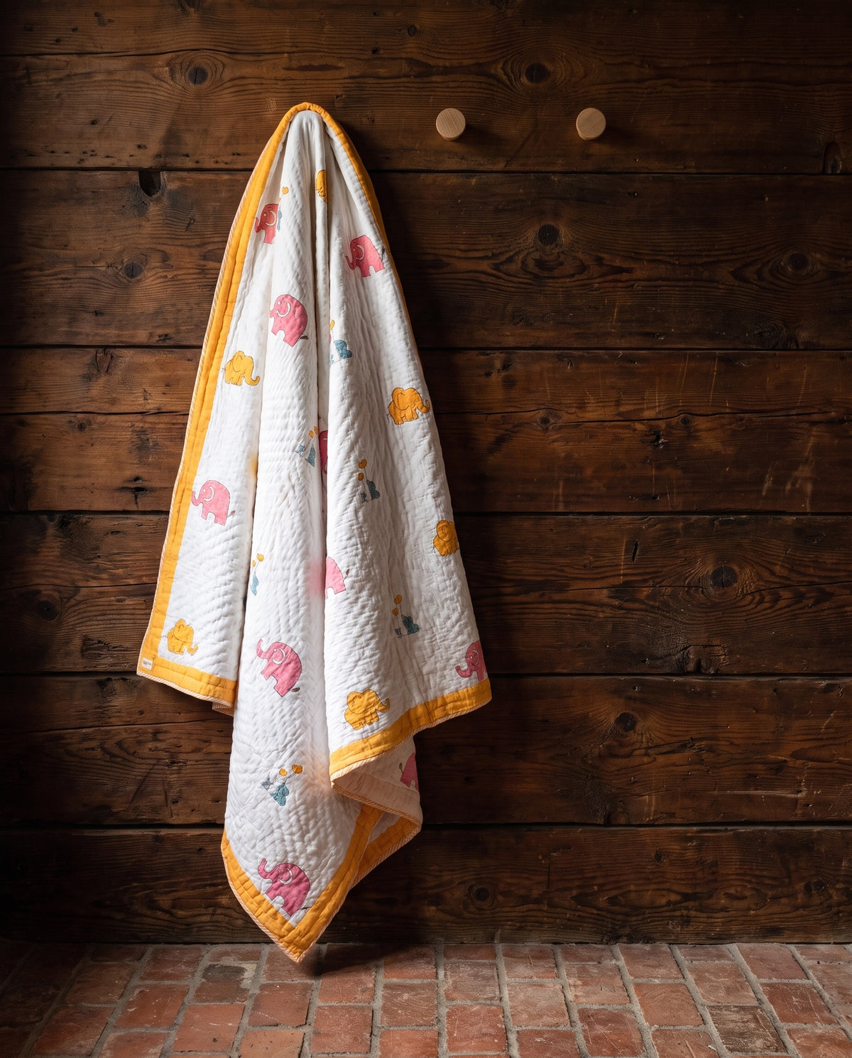 Elephant Wishes reversible cotton baby blanket, side one, rustic pegs