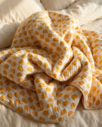 Elephant Wishes reversible cotton baby blanket, side two, bed editorial