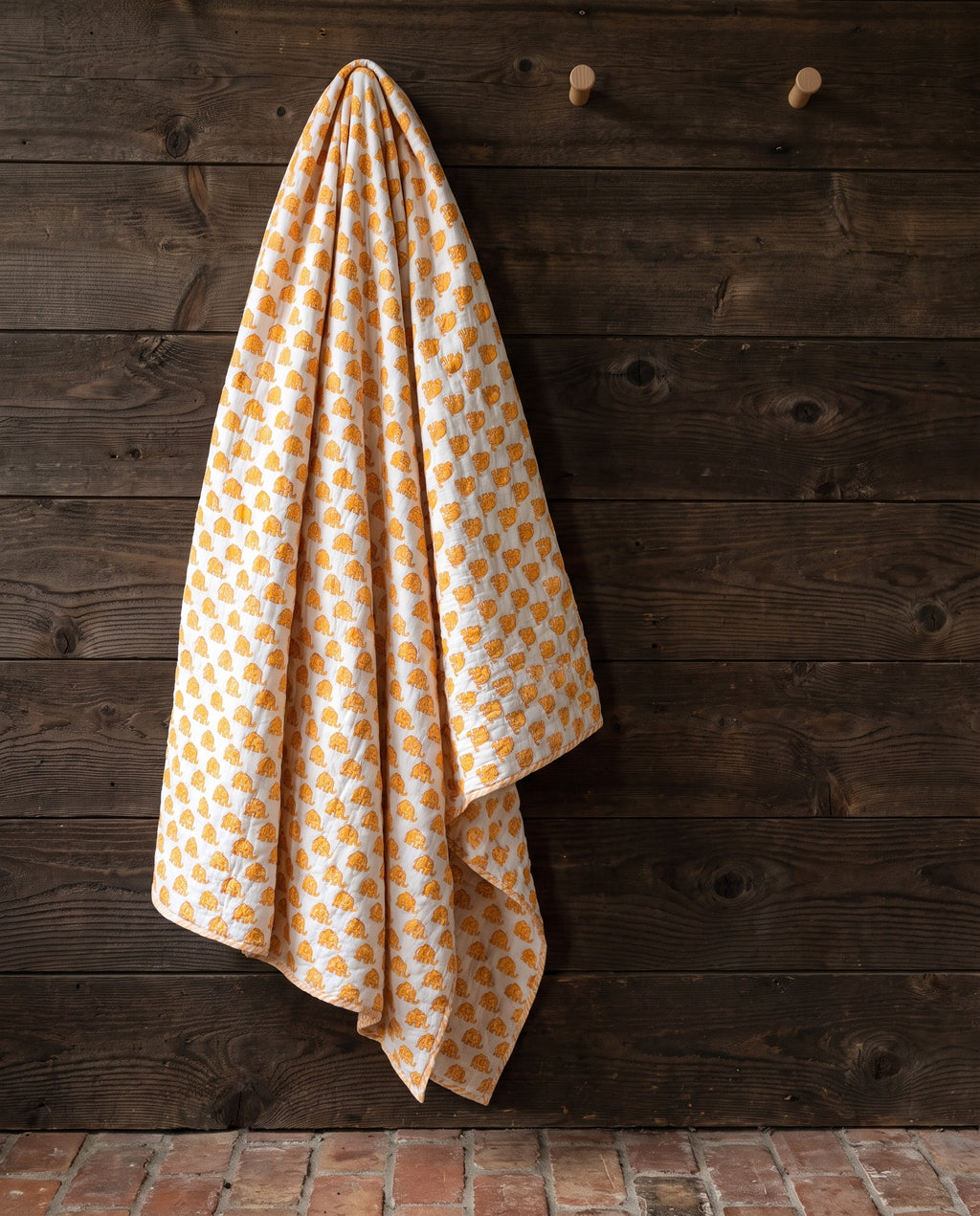Elephant Wishes reversible cotton baby blanket, side two, rustic pegs