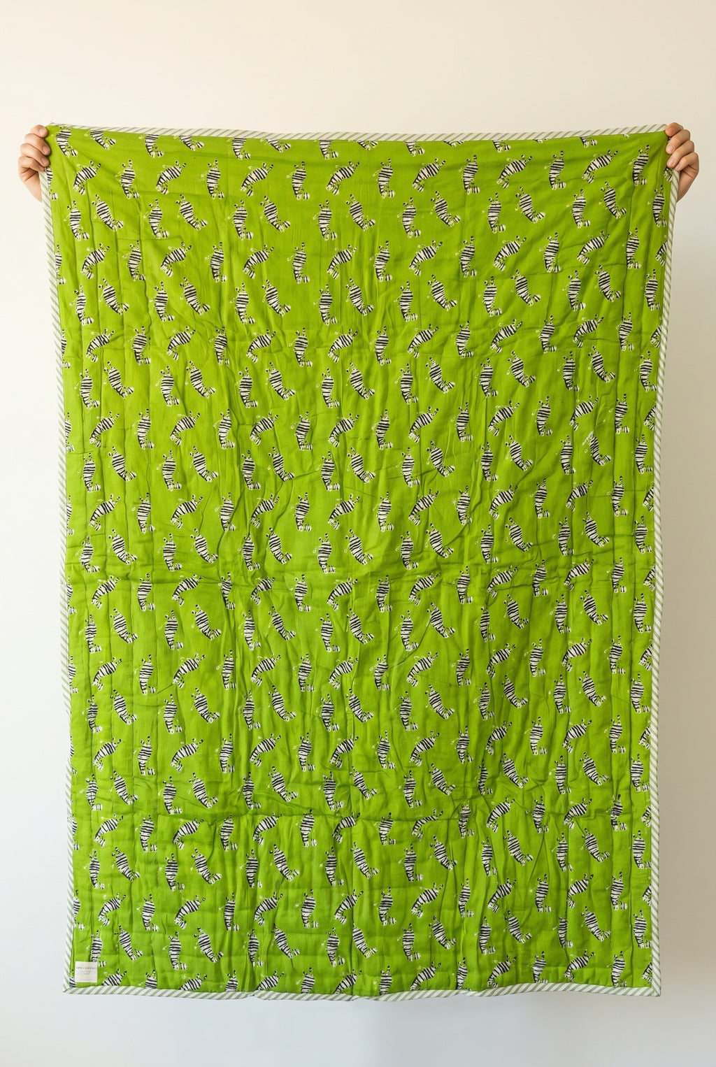 Zebra Wanderings reversible cotton baby blanket, side one, catalog hold