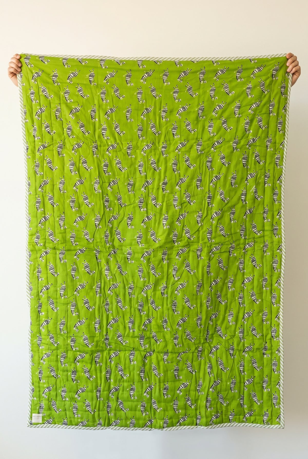 Zebra Wanderings reversible cotton baby blanket, side one, catalog hold