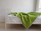 Zebra Wanderings reversible cotton baby blanket, side one, iron bed