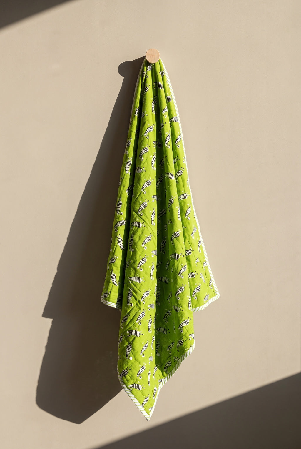 Zebra Wanderings reversible cotton baby blanket, side one, peg
