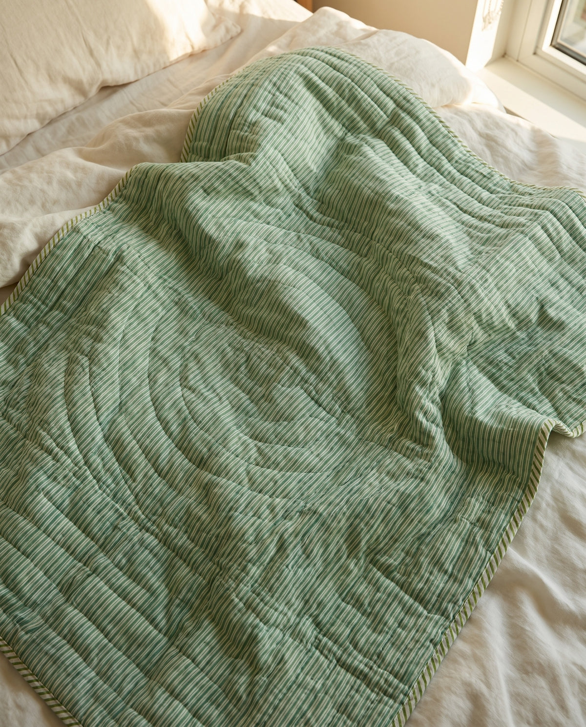 Zebra Wanderings reversible cotton baby blanket, side two, bed editorial
