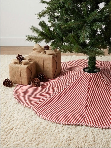 Four different views of a checkered Christmas tree skirt on a tree.