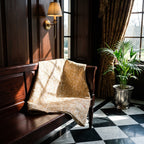 Wild Bergamot Bagru Block Print Kantha Throw — reverse side styled in a home entryway