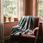Hawthorn Bagru Kantha Throw — front draped over a chair in a cosy reading nook