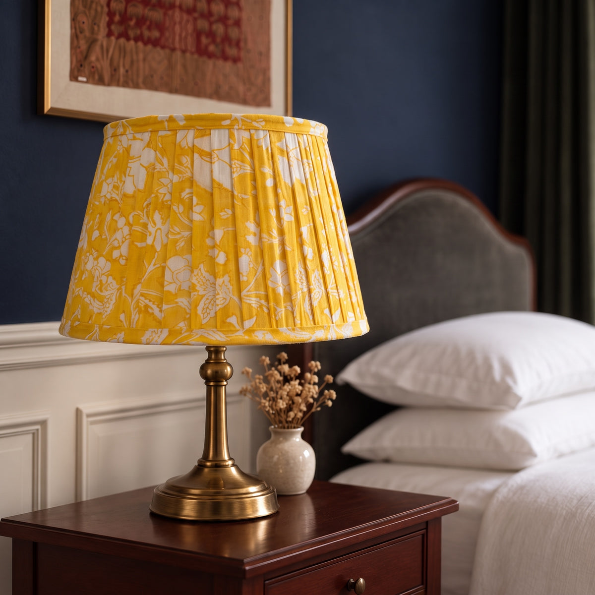 Handmade pleated cotton lampshade glowing in an elevated interior
