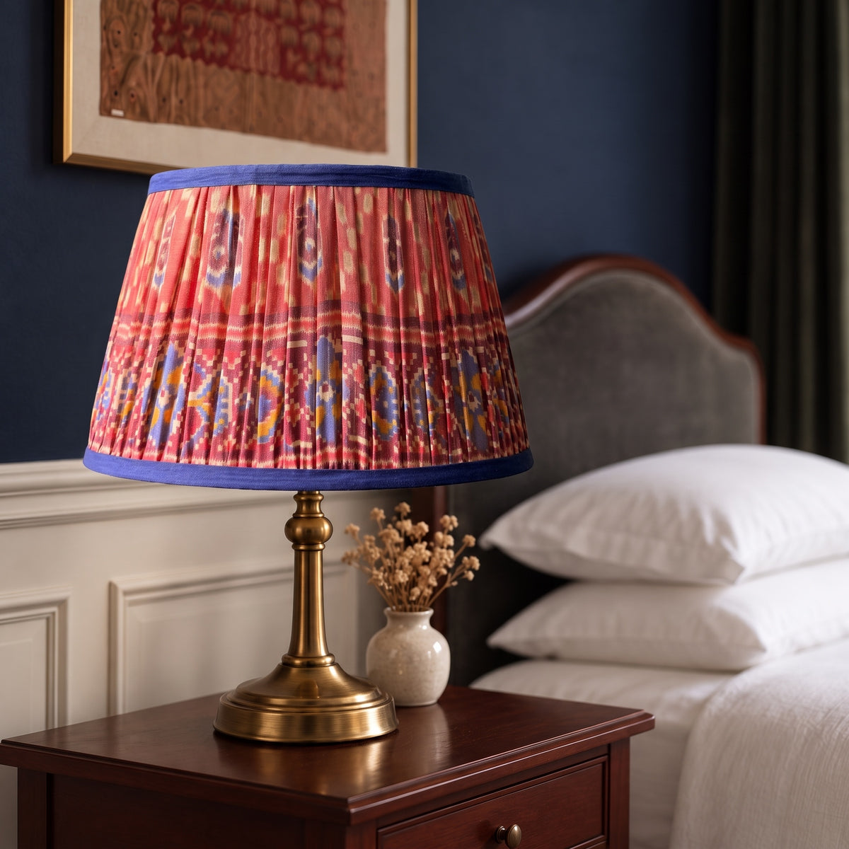 Handmade pleated cotton lampshade glowing in an elevated interior