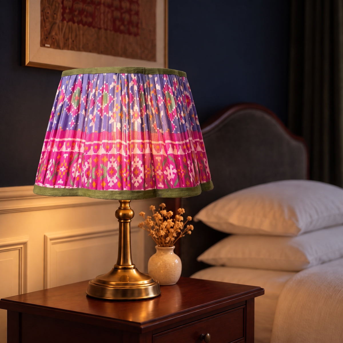 Handmade pleated cotton lampshade glowing in an elevated interior