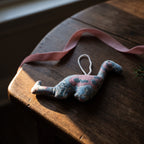 Handcrafted cotton elephant or dinosaur Christmas ornament – Whisper Mist design, styled photo. Example from random pack of six.