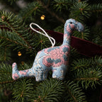 Handcrafted cotton elephant or dinosaur Christmas ornament – Whisper Mist design, hanging on a Christmas tree. Example from random pack of six.