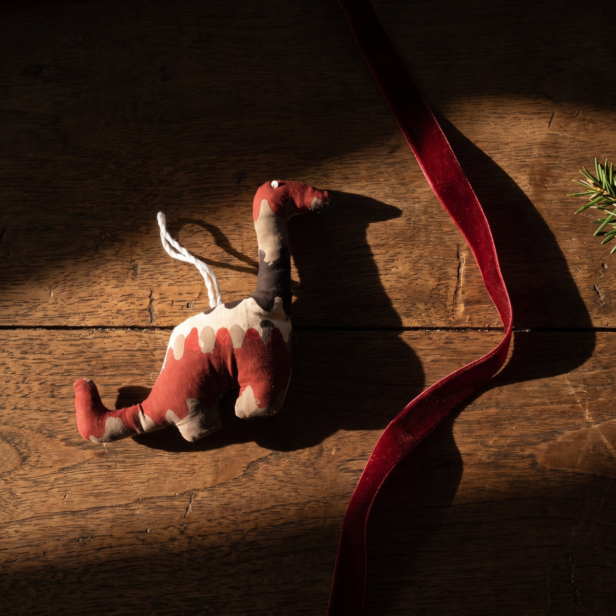 Handcrafted cotton elephant or dinosaur Christmas ornament – Blue Day design, styled photo. Example from random pack of six.