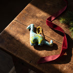 Handcrafted cotton elephant or dinosaur Christmas ornament – Glimmer Amber design, styled photo. Example from random pack of six.