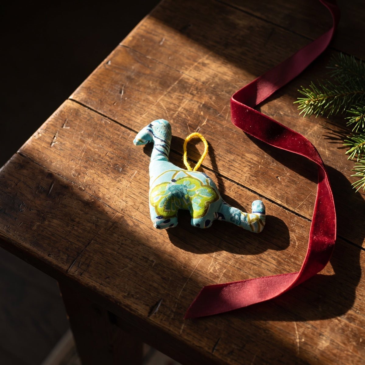 Handcrafted cotton elephant or dinosaur Christmas ornament – Glimmer Amber design, styled photo. Example from random pack of six.